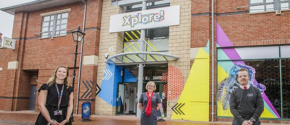 Image of Katie Williams, Business Development and Stakeholder Engagement Officer at Xplore! with Principality's Wrexham branch colleagues outside of the Xplore! centre