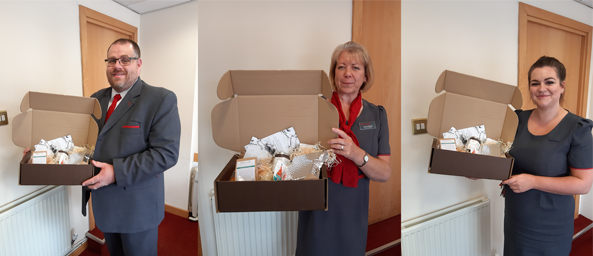 Image of colleagues from Principality's Hereford branch showing the afternoon tea kits
