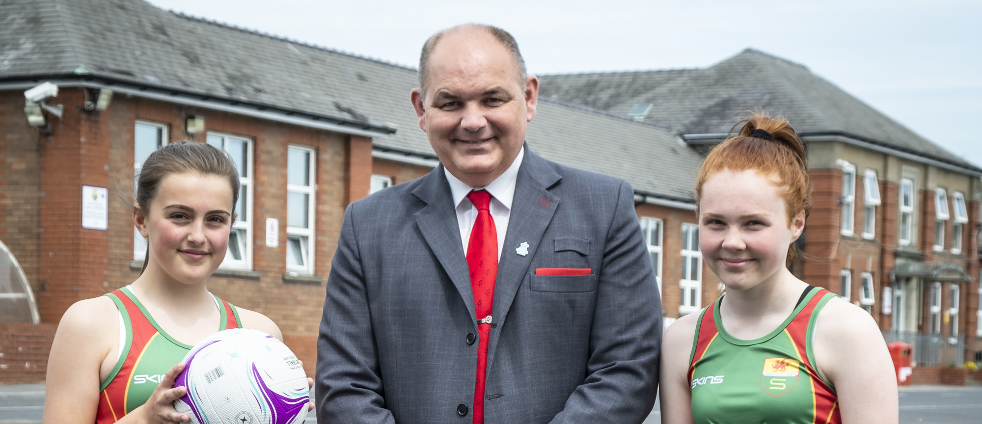 Jeremy Evans, Senior Branch Manager at Principality's Llanelli branch was delighted to handover the new season kit to Ysgol Y Strade's budding netball team.