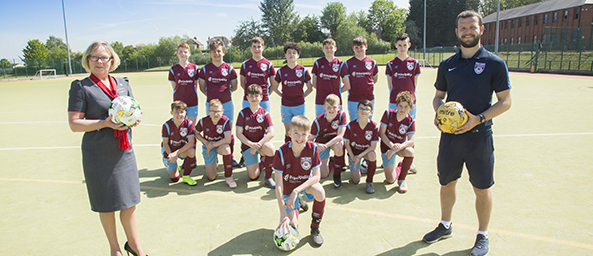 Wrexham school look good in front of goal after new season kit donation